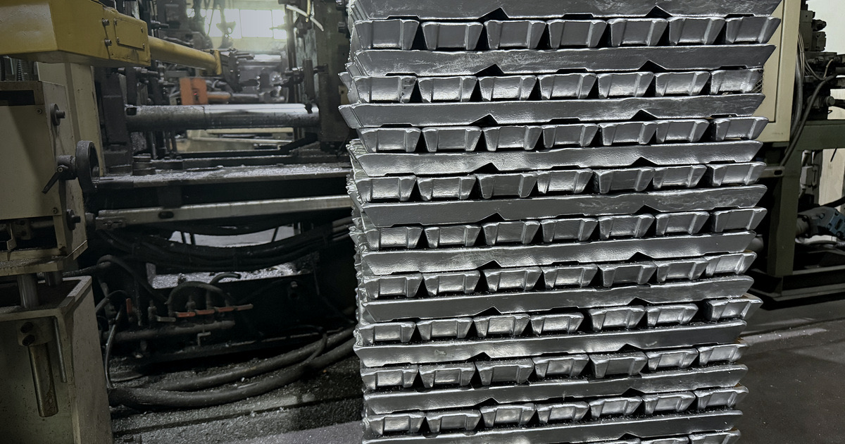 Stacked ADC12 aluminum ingots beside the die casting machines at SunOn