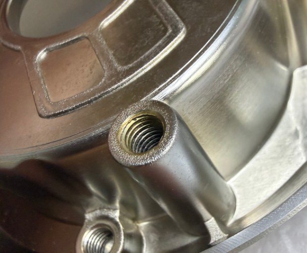 Clean threaded hole after the process change