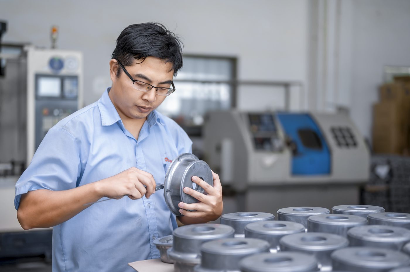 Engineer examining a cast component