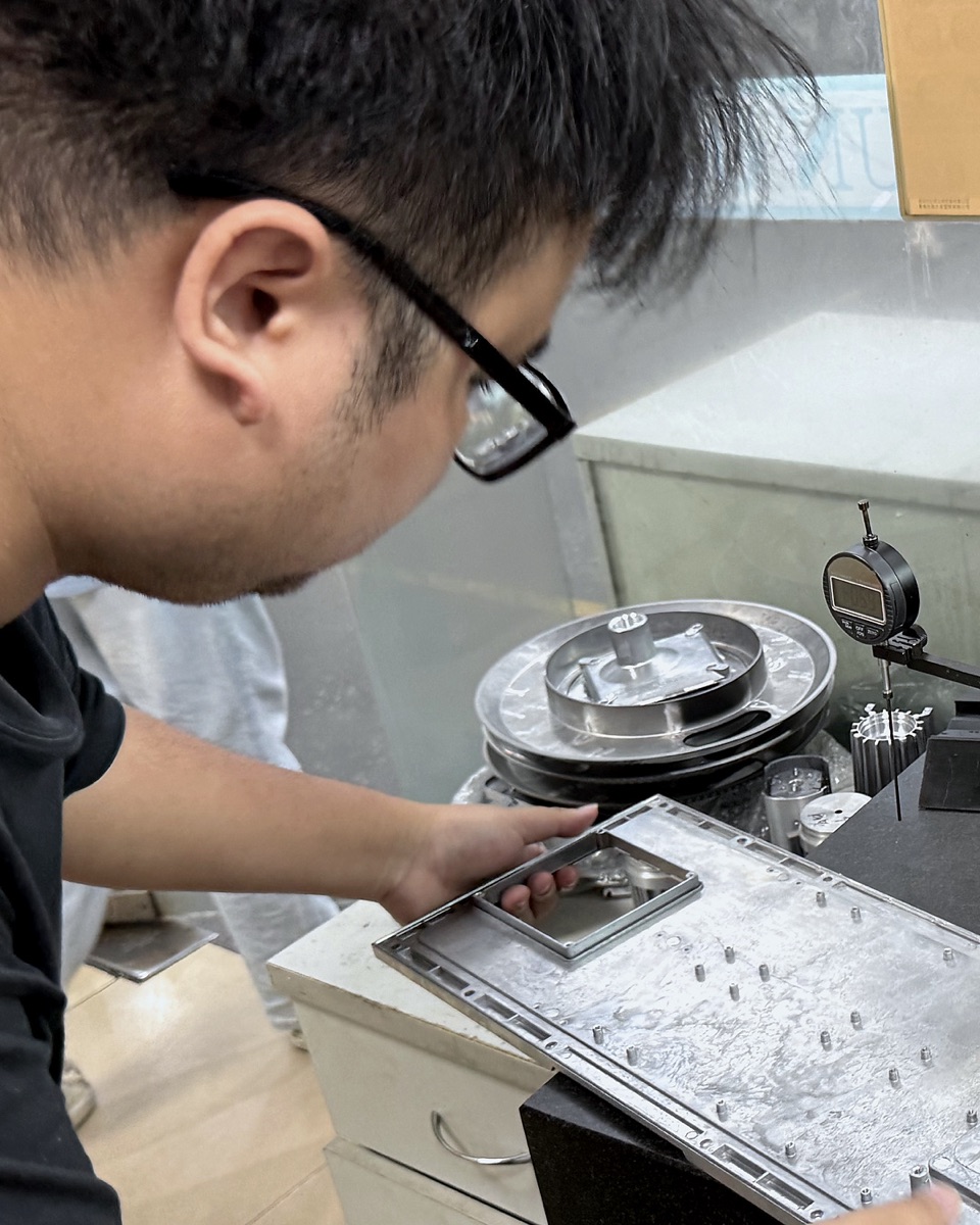 Dimensional inspection of a machined part at the QC bench