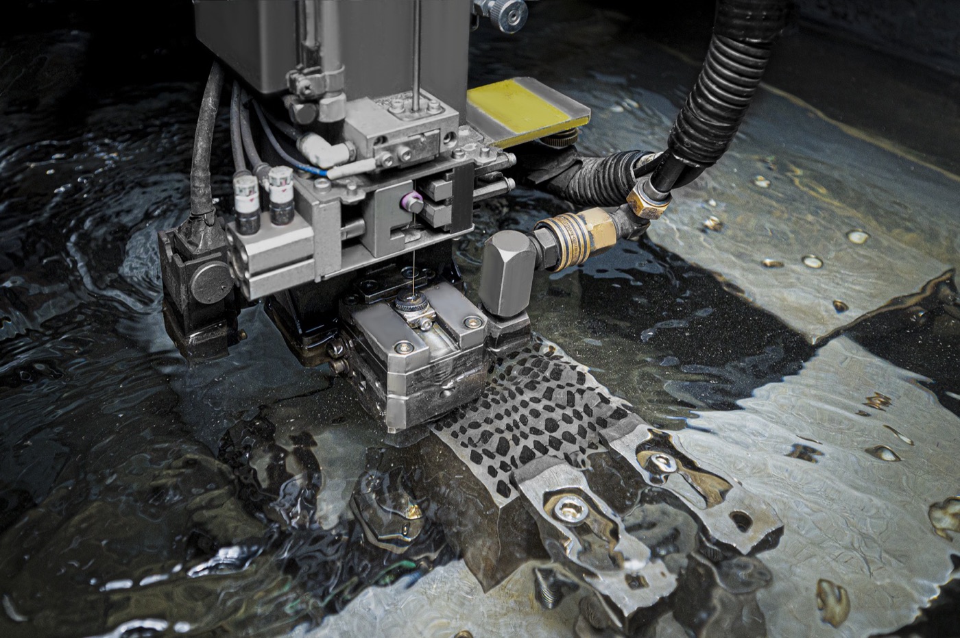 Coordinate measuring machine inspecting a machined part