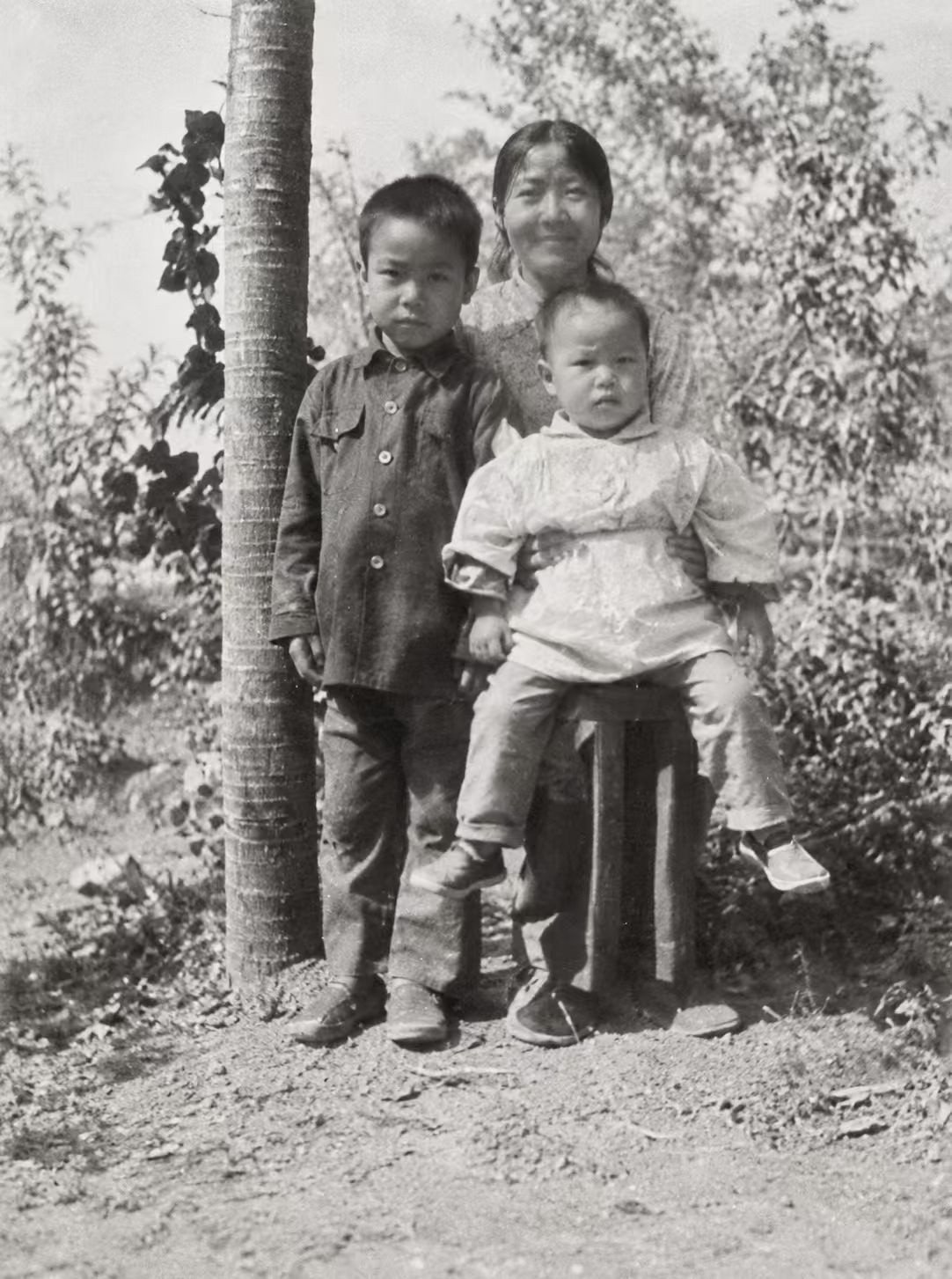 With his mother and younger sister