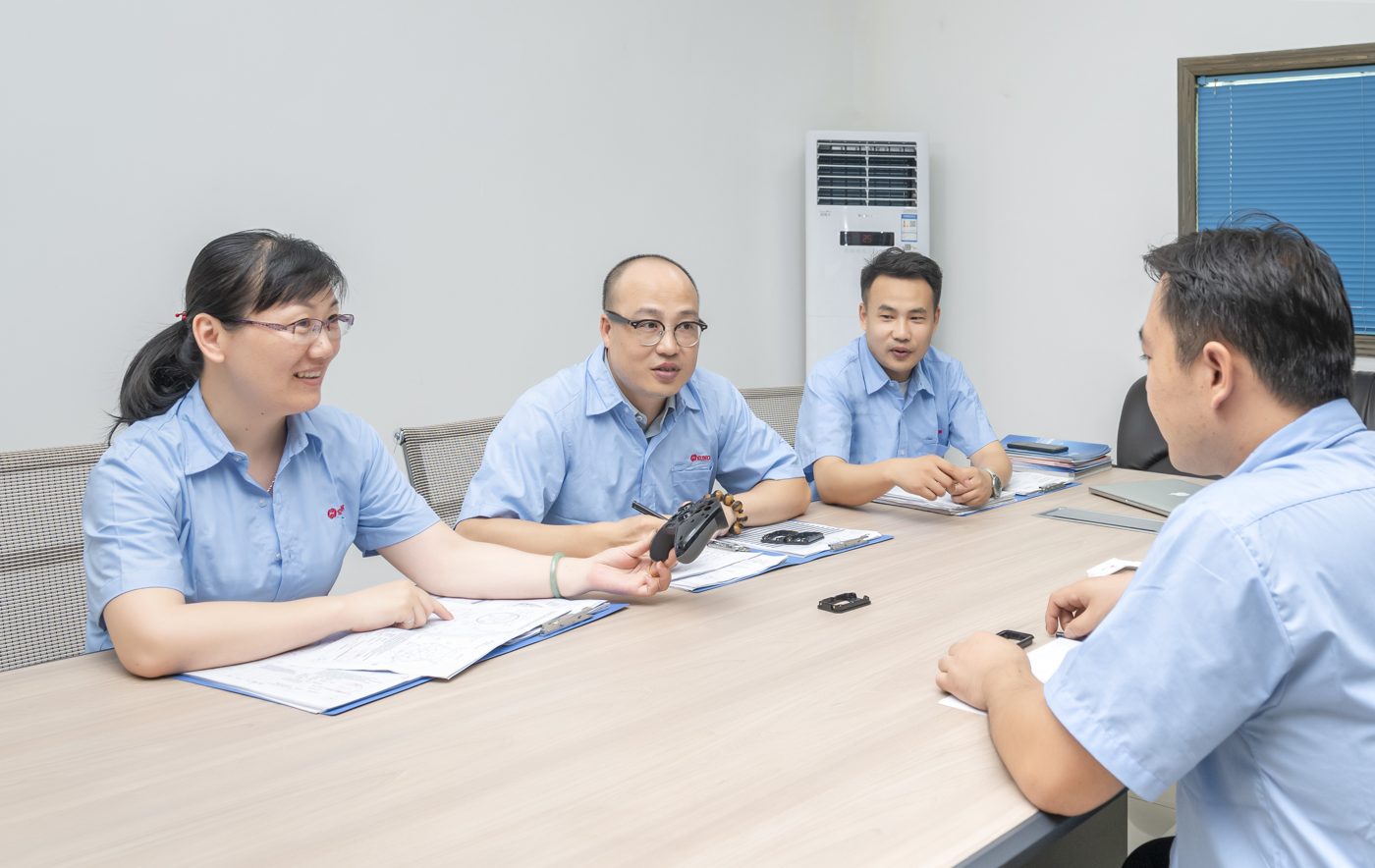 Team reviewing a project in a meeting room