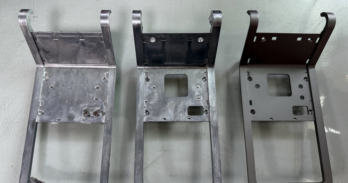 Cast, trimmed and machined stages of an aluminum part shown side by side